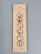 Set of six Guinness fancy vest buttons on original card, including toucan, seal, tortoise etc