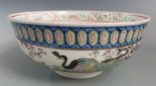 A 19th/20thC Chinese pedestal bowl decorated with peacocks amongst prunus blossom, with six