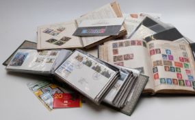 Two albums of first day covers and presentation packs, an album of coin / stamp first day covers,