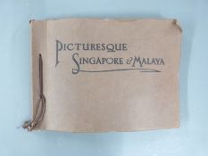 A photo album plus loose photos and postcards of Singapore and Malaya, circa 1920's
