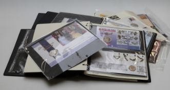 Three stamp and coin albums with first day covers containing collectable coin covers including £