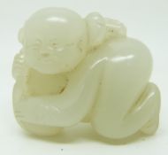 Chinese 19thC jade model of a boy grasping peaches, 3.5 x 3cm