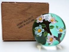 William Manson 'weight in a crate' paperweight with lampwork flowers on green ground and signature
