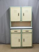 A retro metal kitchen cabinet/dresser with four vented doors and two drawers, one with cutlery
