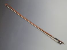 Violin bow by H R Pfretzschner, round stick, mother of pearl eye to frog, impressed with coat of