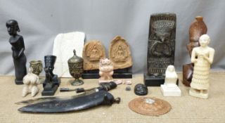 Collection of tribal figures, stone carvings, brass goblet with hardstone cabochons, enamelled