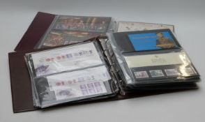Two albums of mint stamps, definitives, presentation packs and booklets. Face value at least £390