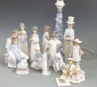 A quantity of Lladro/Nao figures including a figural lamp, tallest 32cm