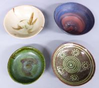 Four studio pottery bowls, two signed, maximum diameter 18cm
