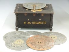 Atlas-organette musical box with six interchangeable 22.5cm ployphon style discs, overall width