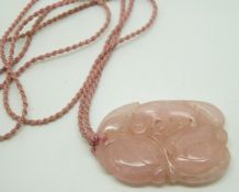 Chinese rose quartz carving of a bat and peaches on a rope necklace, 5.5 x 3.5cm