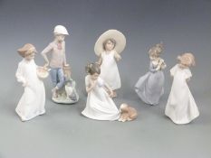 Six Nao child figures including boy with dog, tallest 23cm