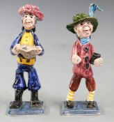 A pair of Alan Young pottery figures, one a pirate with map, the other with a cup, approximate
