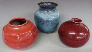 Three Koch pottery, Workum, Netherlands, vases with red and blue glazes, tallest 22.5cm
