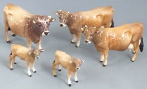 A collection of Beswick Jersey cattle, tallest 12cm