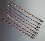Seven octagonal stick violin bows, various button types, plain eyes to frogs