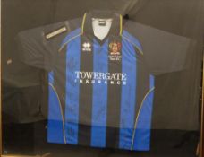 Cheltenham Town and Cambridge United signed football shirt in display frame, titled 'won on Saturday