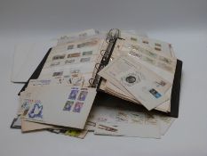 A collection of Rhodesia stamps in three albums together with first day covers