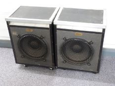 A pair of Goodmans speakers mounted in reinforced travel cases on castors, speaker cone diameter