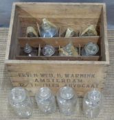 Twelve fluid/chemical jar/bottles in Erven Wed. H. Warnink, Amsterdam advocaat case