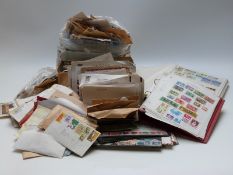 Large collection of stamps and trade cards, loose, on cover and in stockbooks