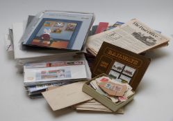 A box of sundries including presentation packs, packs of spare album sheets, Isle of Man books and