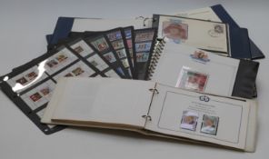 Four Royalty omnibus stamp albums and loose Hagner sheets