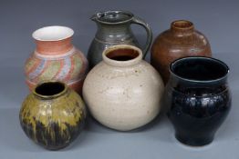 A collection of Studio pottery vases and jugs including an ash glazed vase, probably by Adam Beales,