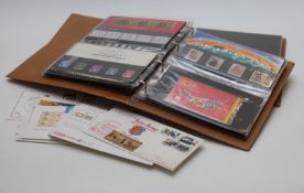 Two albums of GB presentation packs and loose first day covers