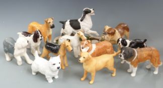 A collection of Beswick dogs, two in boxes, tallest 20cm