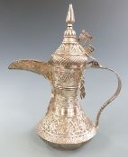 Middle Eastern ewer with raised textured decoration, 29cm tall