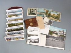 A collection of souvenir postcards and photographs including Barcelona, Montreal, Maine, Niagra
