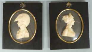 Pair of 20thC carved wax silhouettes by Lesley Ray, London, depicting a lady and military gentleman,