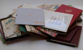 A large quantity of all-world stamps in multiple albums and stockbooks including some mint GB,