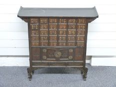 Chinese/Korean chest of thirty drawers over a two door cabinet, W77 x D25 x H77cm