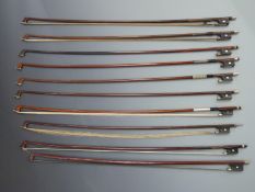Ten round stick violin bows with various button types, plain eyes to frogs