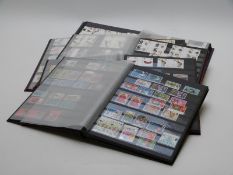 Five albums of mint unused UK gutter pairs / strips / blocks, high face value