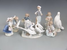 A collection of Lladro and Nao figures, tallest 24cm