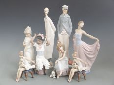A collection of Lladro and Nao figures, tallest 38cm