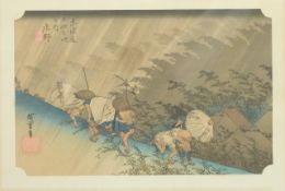 A 19th/20thC Japanese print of travellers on a hillside in a storm, 22 x 34cm