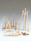 Five small table top artist's easels, tallest 58cm