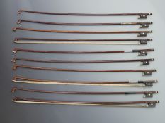 Ten round stick violin bows with three part buttons, mother of pearl eye to frogs