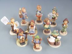 A collection of Goebel Hummel figures including Newspaper Vendor, tallest 14cm