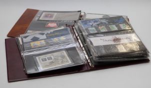 Two albums of mint stamps, definitives, presentation packs and booklets. Face value at least £300