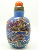 Chinese glass scent bottle with raised enamel dragon decoration and four character mark to base,