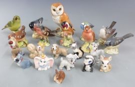 A collection of Beswick birds and Wade figures, mostly Disney, tallest 11.5cm