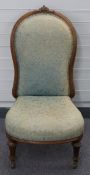 Mahogany upholstered nursing chair with ceramic castors