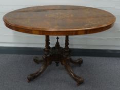 Victorian inlaid tilt top table raised on four carved legs, W120 x D88 x H70cm
