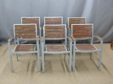 Six stackable metal garden chairs with wooden seats