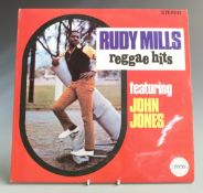 Rudy Mills - Reggae Hits (SEC012) record and cover appear at least Ex